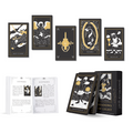 Cards, guidebook, and box: “Shadows of Light tarot deck with black, white and gold cards, an open guidebook, and matching box.”