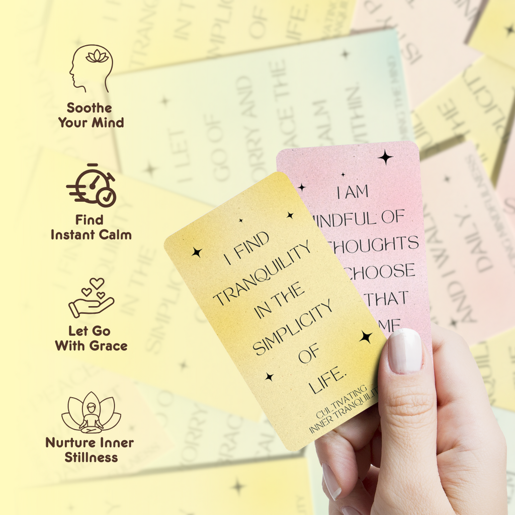 Hand holding two cards: “Hand holding pink and yellow Inner Peace affirmation cards with messages about mindfulness and tranquility.”