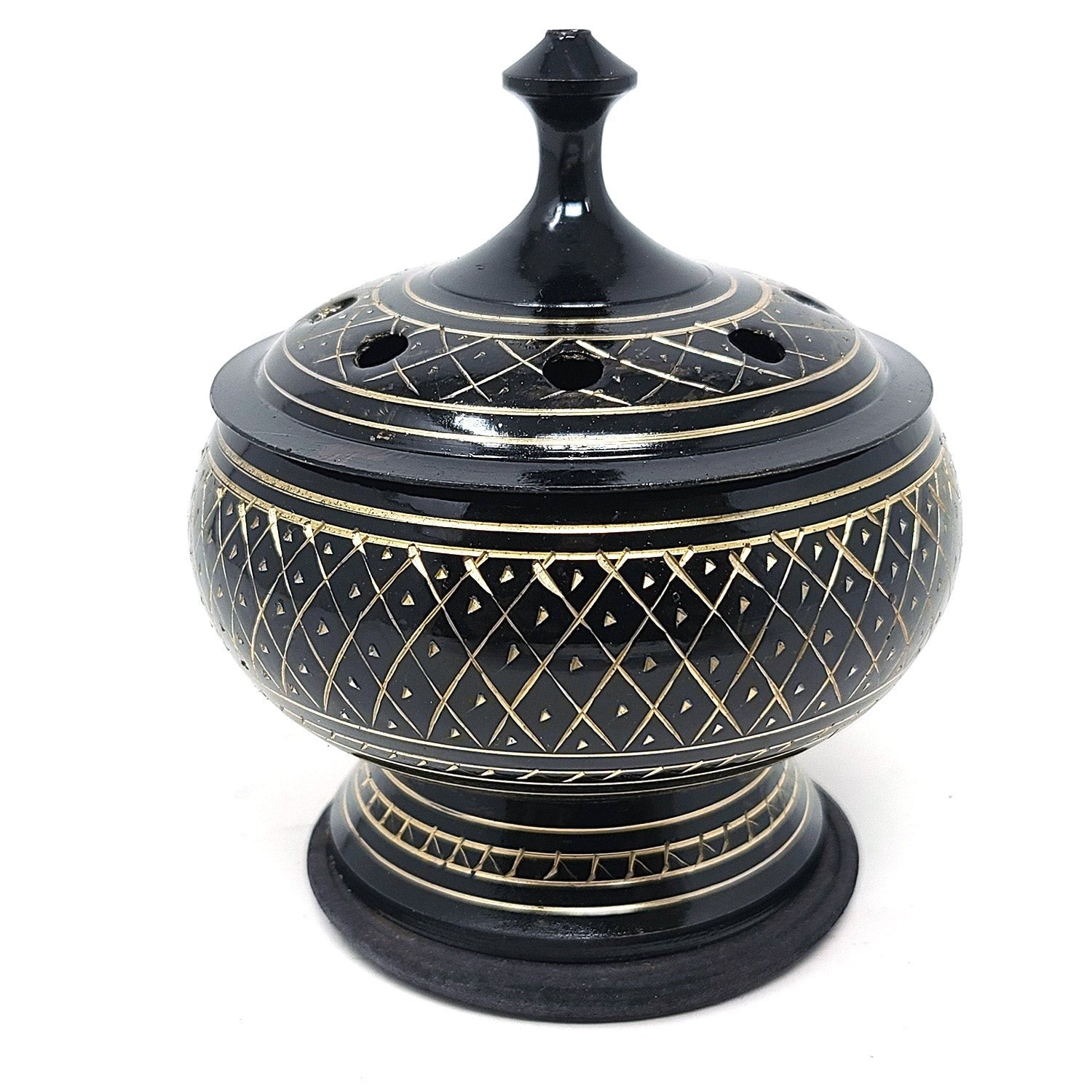 Crystal Fairy Patch black carved brass incense burner with intricate gold-tone etching, lid, and wooden coaster base.