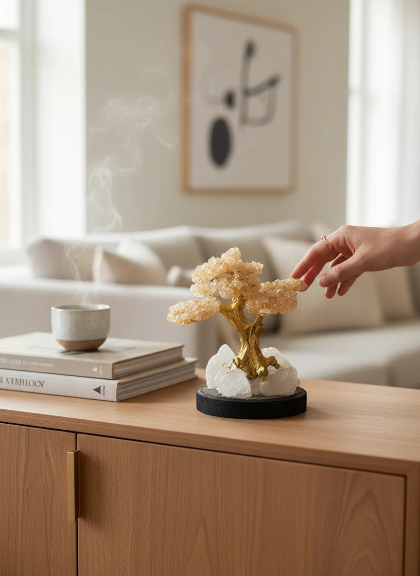 Crystal Fairy Patch Citrine Bonsai Tree with golden crystal leaves on a raw quartz and pyrite base, displayed on a wooden table.