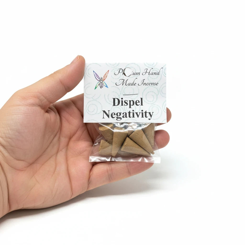 Crystal Fairy Patch Dispel Negativity handmade cone incense pack held in a hand for energy cleansing and spiritual practice