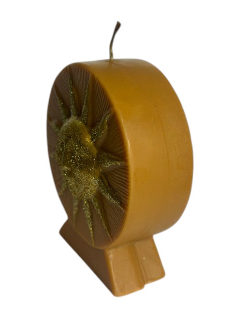 Crystal Fairy Patch Golden Sun handcrafted candle in honey-colored wax with embossed sun face and shimmering gold glitter accents.