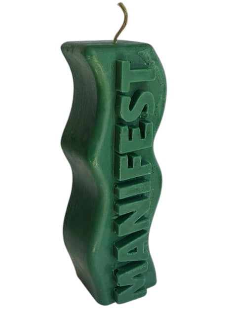 Crystal Fairy Patch green handcrafted sculptural candle with a wavy silhouette and raised MANIFEST lettering for meditation.