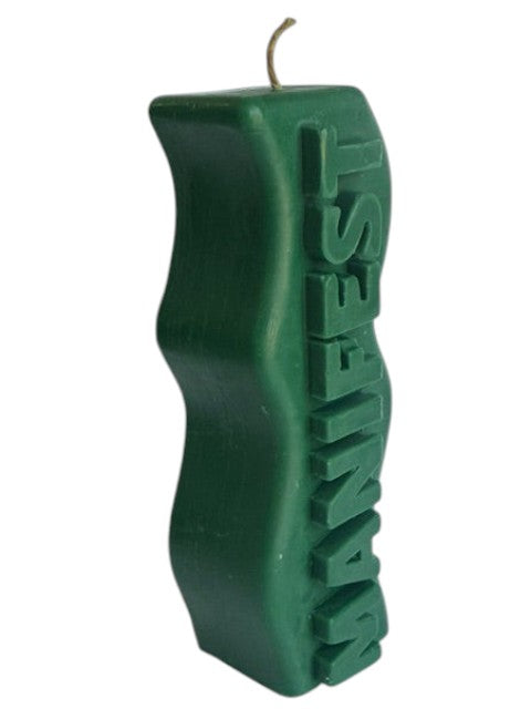 Crystal Fairy Patch green sculptural pillar candle with a wavy silhouette and raised MANIFEST lettering for meditation.