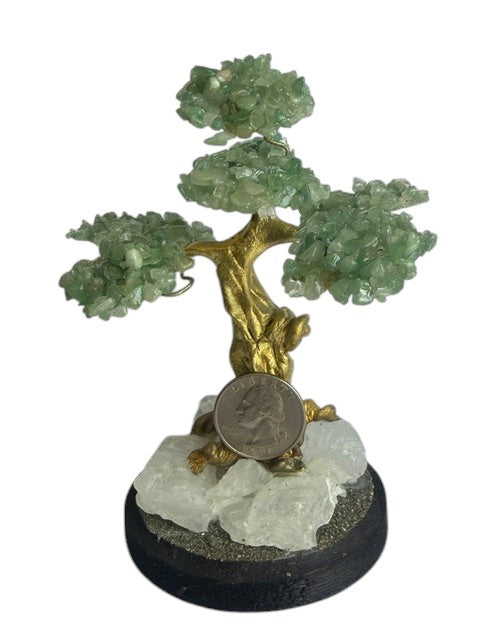 Crystal Fairy Patch jade bonsai tree with green gemstone leaves, gold trunk, and a base of raw quartz and pyrite crystals.