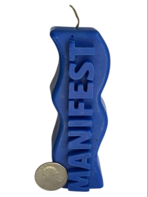 Crystal Fairy Patch blue sculptural candle with a wavy silhouette and raised MANIFEST lettering for meditation and decor.