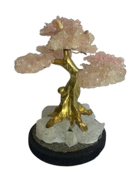 Crystal Fairy Patch Rose Quartz bonsai tree with gold trunk on a raw quartz and pyrite base for home decor.