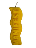 Crystal Fairy Patch yellow handcrafted sculptural candle with a wavy silhouette and raised MANIFEST lettering.