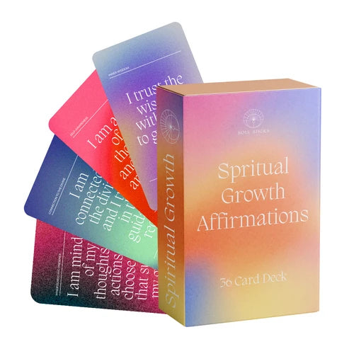 Box with fanned cards: Spiritual Growth Affirmations deck with rainbow-gradient box and colorful cards fanned behind it.