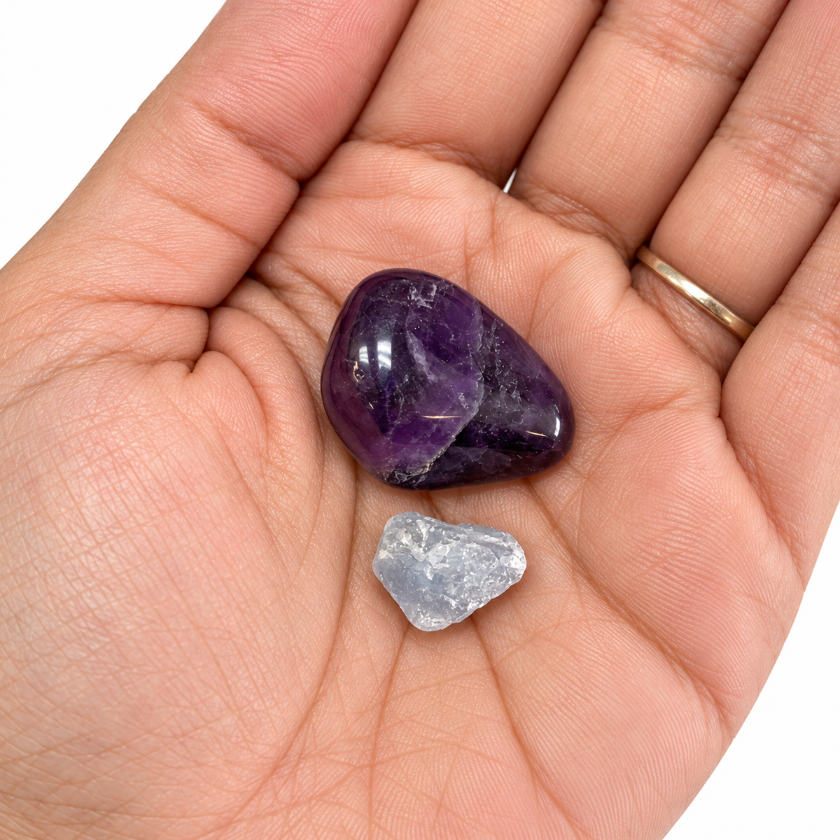 Aquarius Amethyst and rough Celestite in an open palm for size
