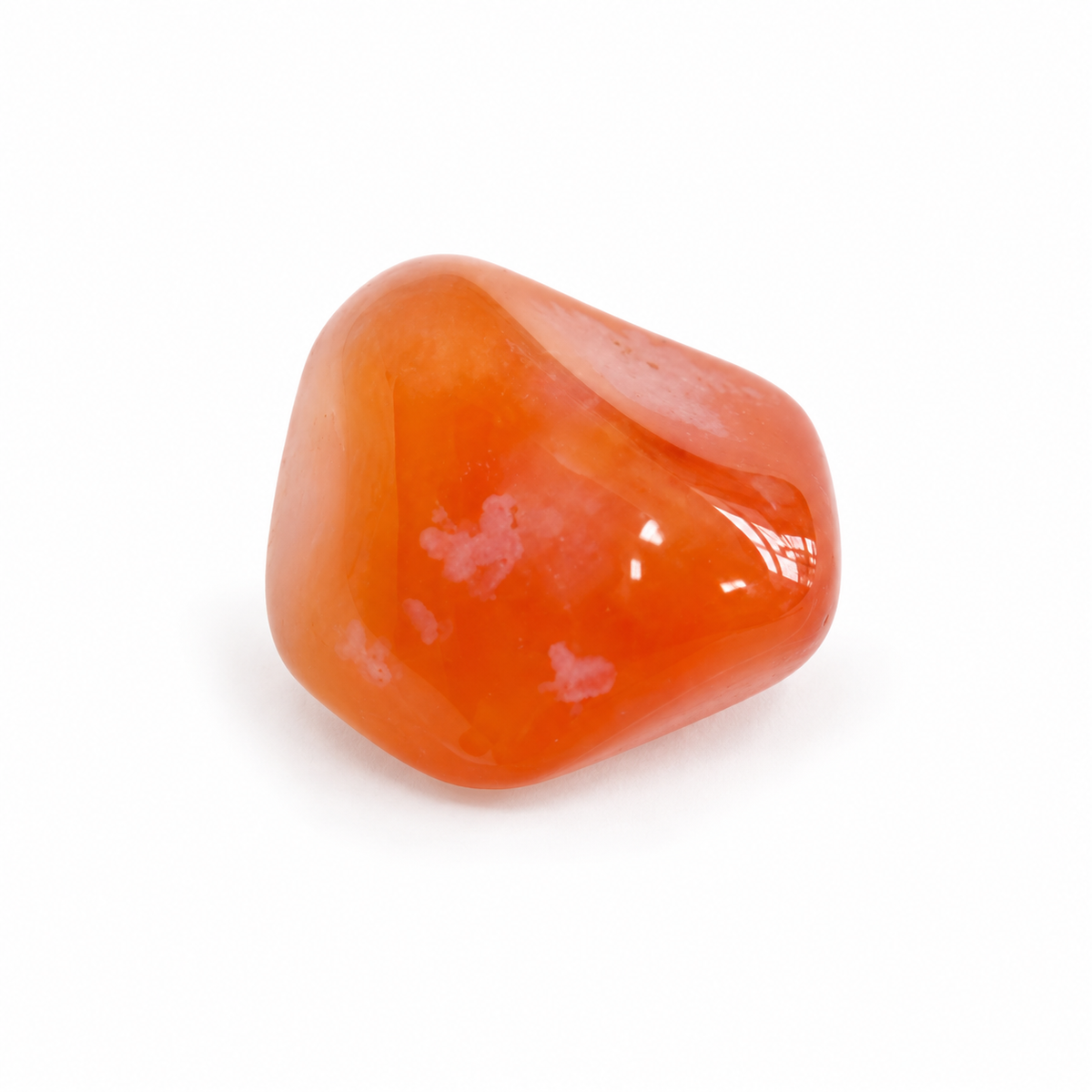 Polished orange Carnelian with natural pale patches on white