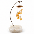 Citrine point desk chime with curved metal stand and rough white quartz base