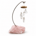 Clear quartz point desk chime with curved metal stand and rough pink rose quartz base