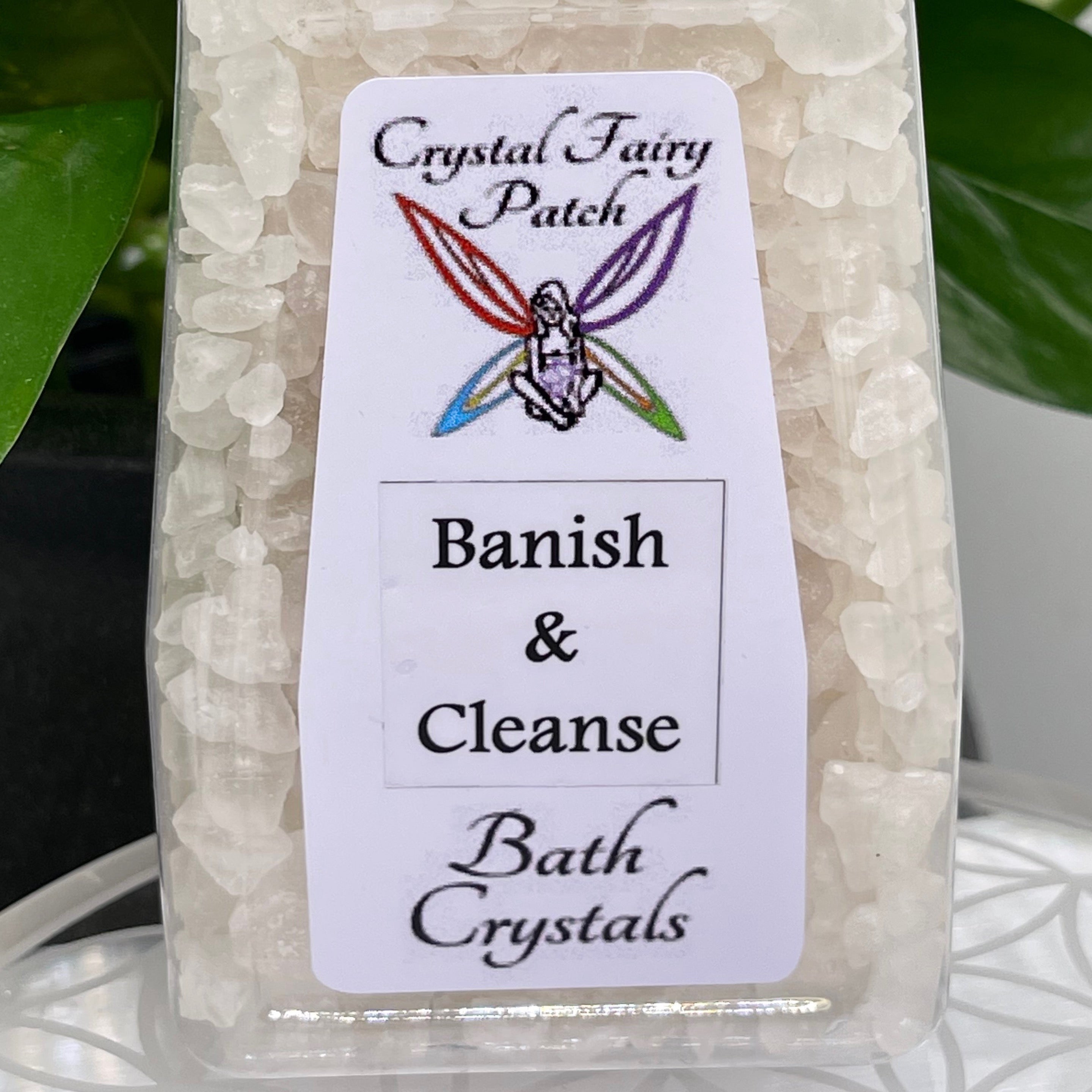 Crystal Fairy Patch Banish and Cleanse bath salt crystals in a clear bottle for energetic clearing.