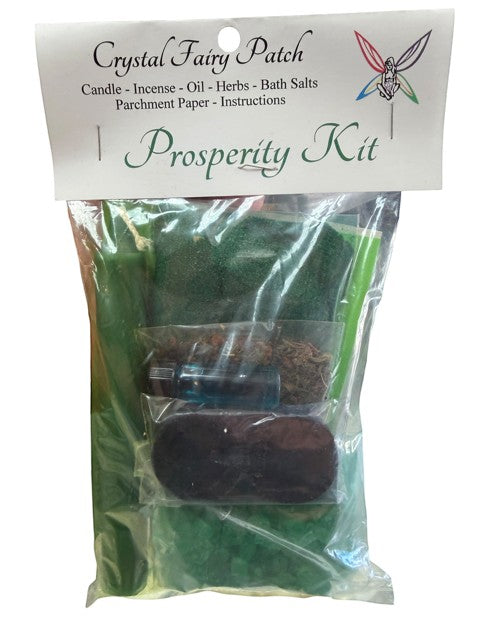 Crystal Fairy Patch Prosperity Ritual Kit with green candle, herbs, oil, bath salts, and charcoal bricks.
