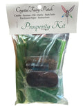 Crystal Fairy Patch Prosperity Ritual Kit with green candle, herbs, oil, bath salts, and charcoal bricks.