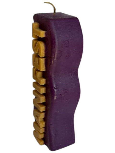 Crystal Fairy Patch purple handcrafted pillar candle with gold embossed MANIFEST text, 4.5 inches tall.