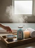 Crystal Fairy Patch Truth bath salt crystals in a jar with a wooden spoon, candle, and towel on a tray for a relaxing bath.