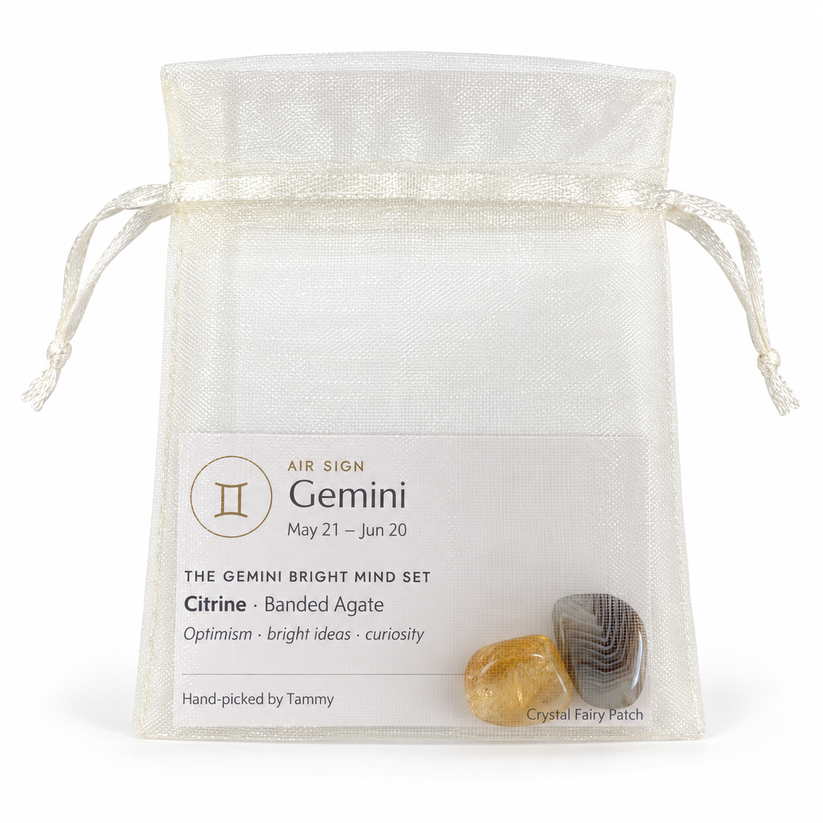 Gemini crystal set with zodiac card inside an ivory organza gift bag
