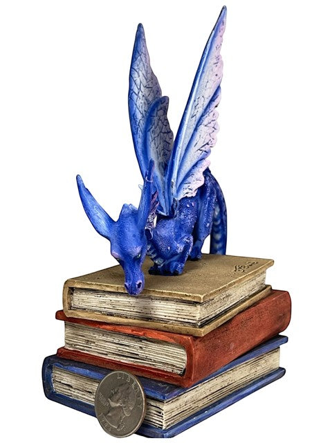 My Store Indigo Book Dragon Figurine by Amy Brown Art, a blue dragon with iridescent scales and purple-pink wings perched on stacked books.