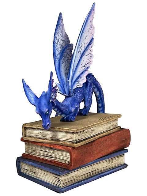 My Store Indigo Book Dragon Figurine by Amy Brown Art, featuring a blue dragon with iridescent scales and purple wings perched on stacked books.
