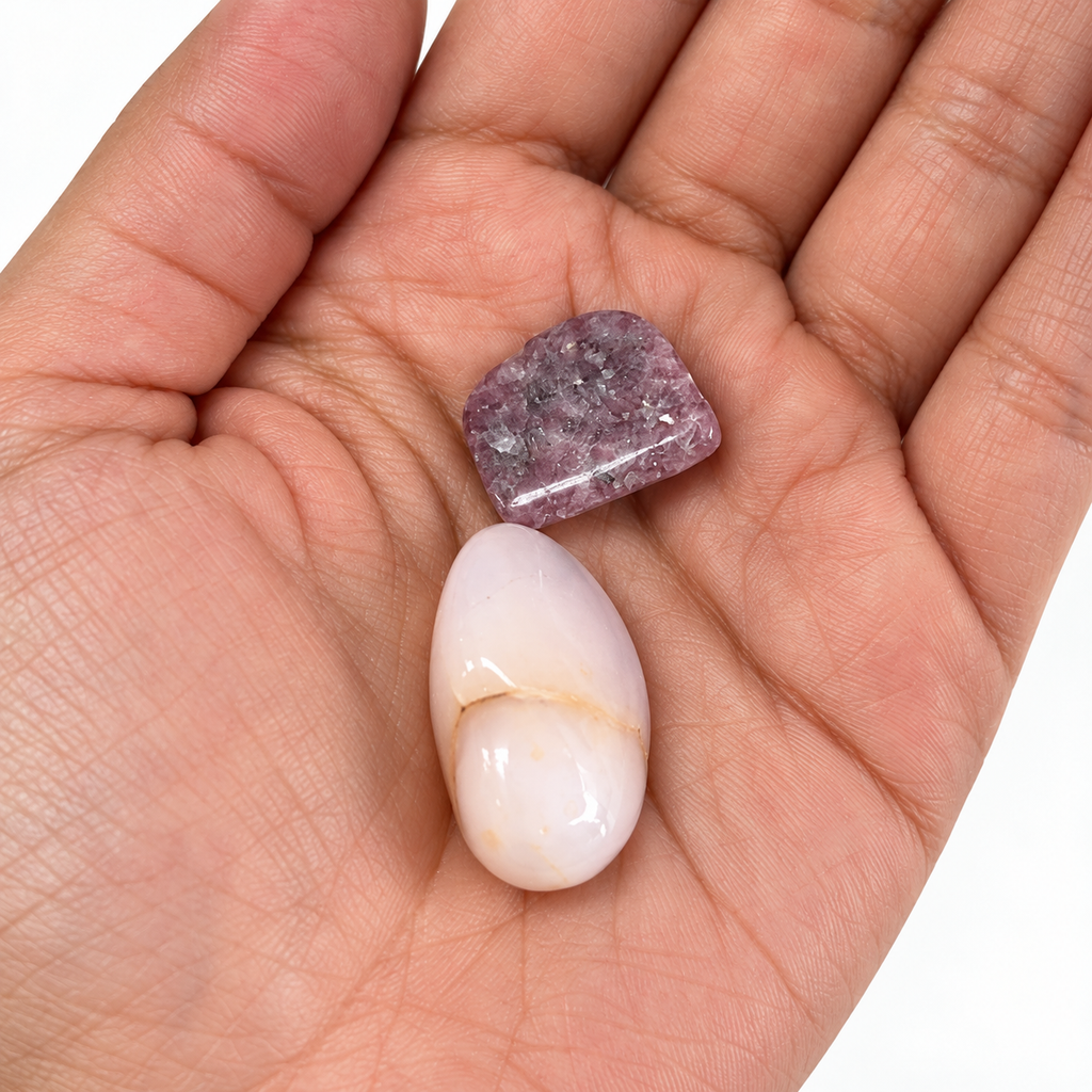 Close-up of Lepidolite and Pink Calcite in an open palm for size