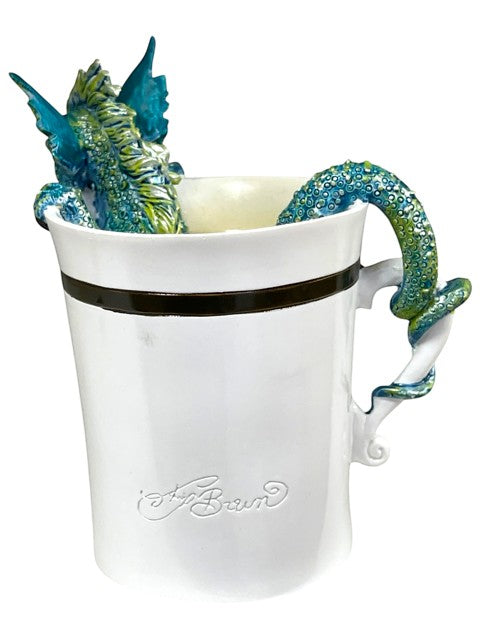 My Store Amy Brown "Good Morning Dragon" white ceramic mug with a teal and green dragon sculpture coiled around the handle and peeking over the rim.