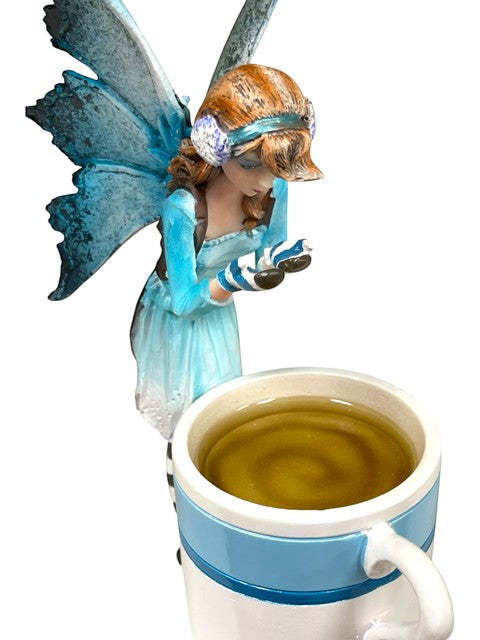 My Store Amy Brown Hot Cocoa Faery Cup figurine with blue wings and striped mittens holding a mug of tea.