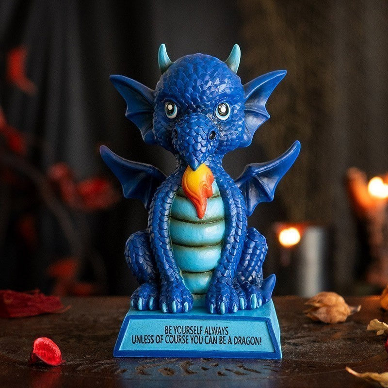 My Store blue dragon figurine with wings, horns, and fire coming from its mouth. Inscribed base reads "Be Yourself Always Unless of Course You Can Be A Dragon!"