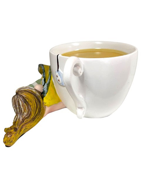 My Store Amy Brown Chamomile Fairy Tea Figurine with yellow dress and blonde hair peeking out of a white teacup.