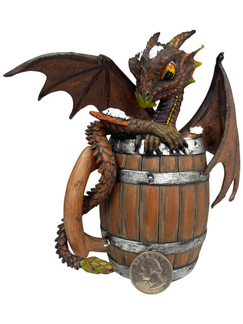My Store Dark Beer Dragon figurine by Stanley Morrison, perched on a wooden barrel with silver bands. Detailed wings, scales, and yellow eyes.
