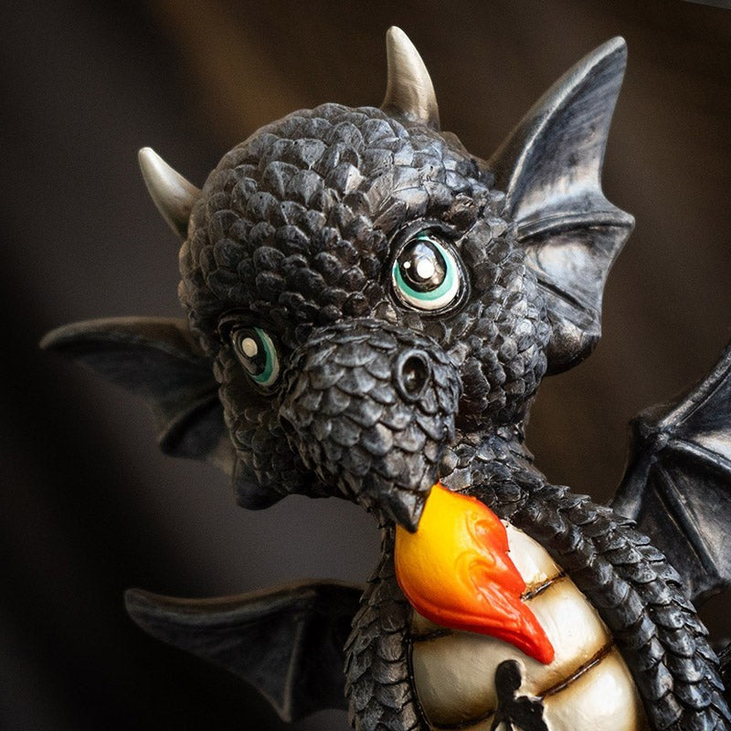 My Store black dragon figurine with intricate scales, wings, and blue eyes, breathing fire. Resin.