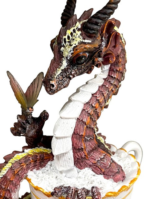 My Store Drinks and Dragons Series Hot Chocolate Dragon Figurine. Brown dragon with yellow and white accents in a white teacup with gold trim.