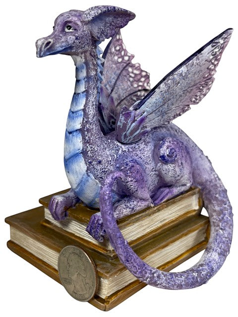 My Store lavender, purple, and blue dragon figurine perched on antique books. Detailed scales and wings.