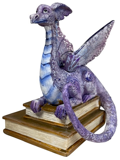 My Store lavender and blue dragon figurine perched on antique books, detailed scales and wings.