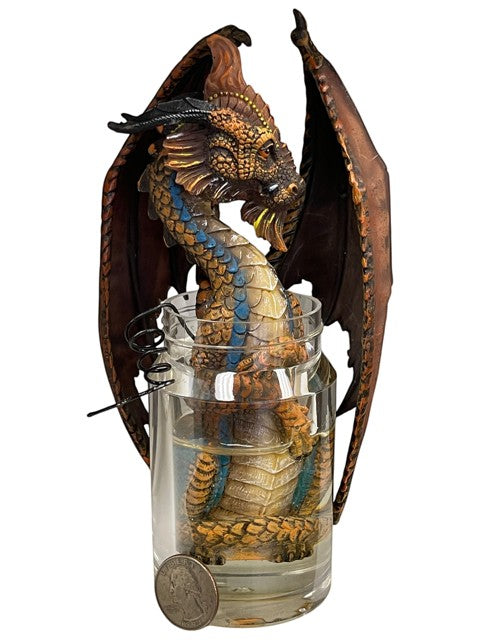 My Store: Winged dragon figurine in a jar, detailed resin with orange, brown, and blue scales. Stanley Morrison.