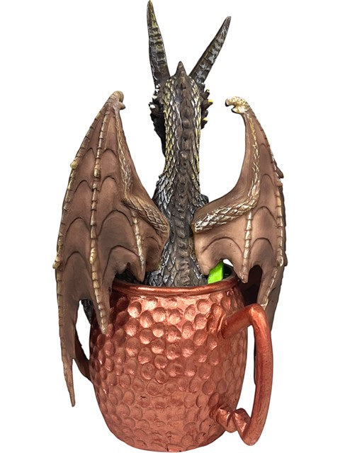 My Store Moscow Mule mug with a detailed dragon figurine emerging from it. Copper mug with hammered texture.