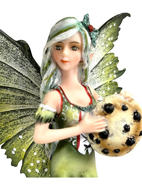 My Store Amy Brown Fairy Christmas figurine holding a chocolate chip cookie. Green dress, white and green hair.