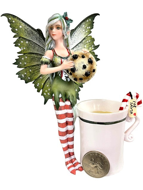 My Store Amy Brown "Fairy Christmas" figurine holding a chocolate chip cookie next to a white teacup with a candy cane.