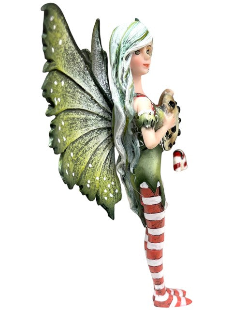My Store Amy Brown "Fairy Christmas" figurine of a fairy holding a chocolate cookie and candy cane, wearing a green dress and striped stockings.