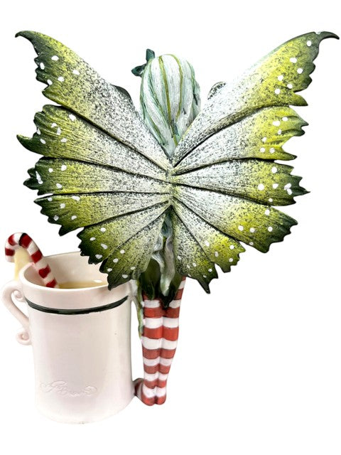 My Store Amy Brown "Fairy Christmas" chocolate cookie and candy cane tea cup. Features a fairy with green wings and striped legs.