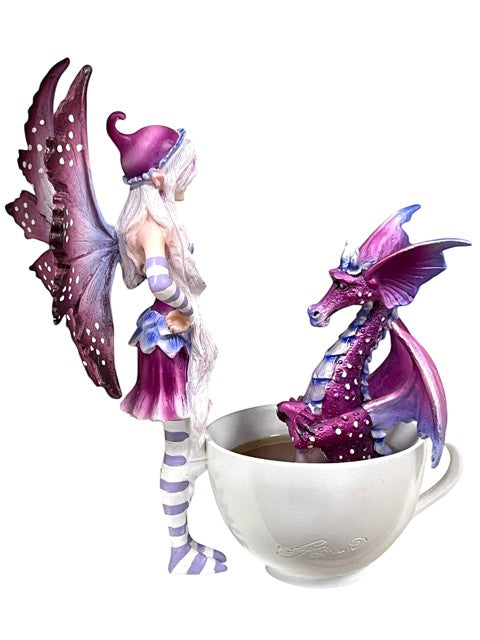 My Store Amy Brown fairy figurine with purple wings and striped stockings next to a purple dragon in a teacup.