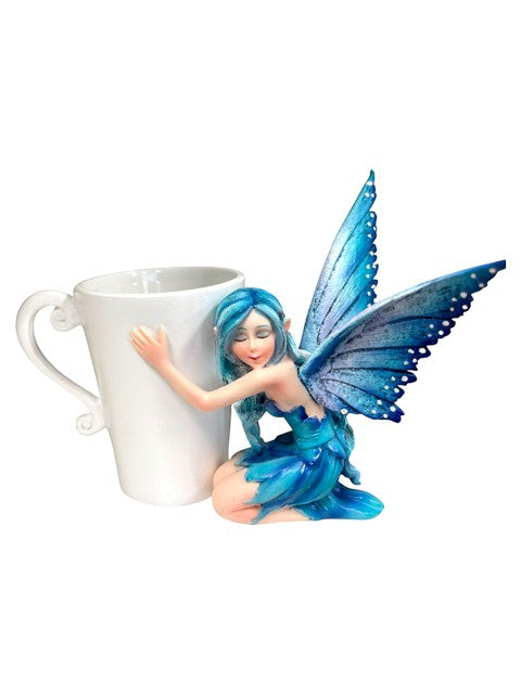 My Store blue fairy figurine hugging a white coffee mug, detailed wings and dress.