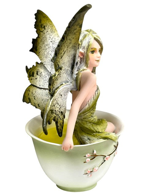 My Store Green Tea Fairy figurine by Amy Brown Art, sitting in a teacup with light green liquid.