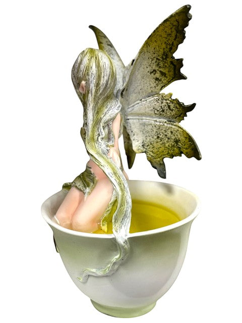My Store Green Tea Fairy figurine by Amy Brown Art, a fairy with green hair and wings sits in a teacup filled with light green liquid.