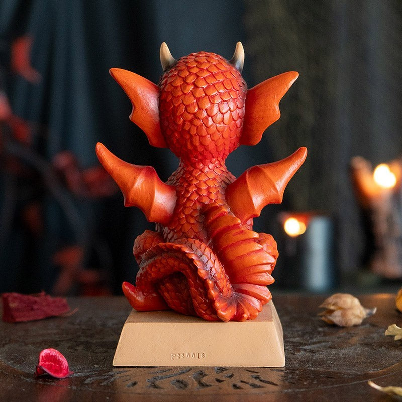 My Store orange dragon figurine with intricate scales, wings, and horns. Features "She's Cute But Fierce" quote on base.