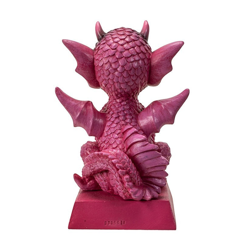 My Store pink dragon figurine with intricate scales, wings, and horns, sitting on a base with a quote.