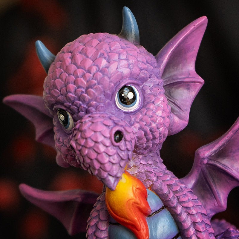My Store purple dragon figurine with blue horns and wings, breathing fire, featuring "She's Cute But Fierce" message.