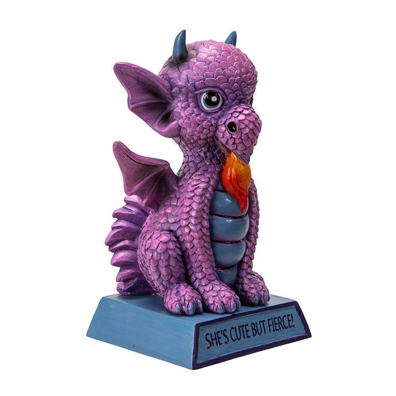 My Store purple dragon figurine with intricate scales, wings, and a flame detail. Inscribed base reads "She's Cute But Fierce!"