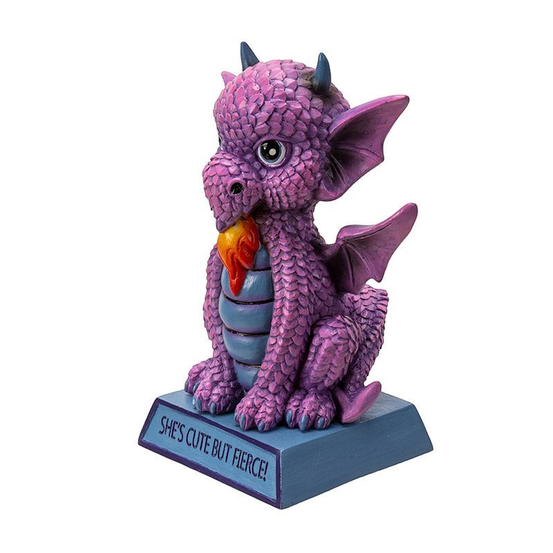 My Store purple dragon figurine with blue accents, wings, and flame in mouth. Inscribed with "She's Cute But Fierce!"